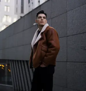 Man wearing a brown jacket with a stylish casual look